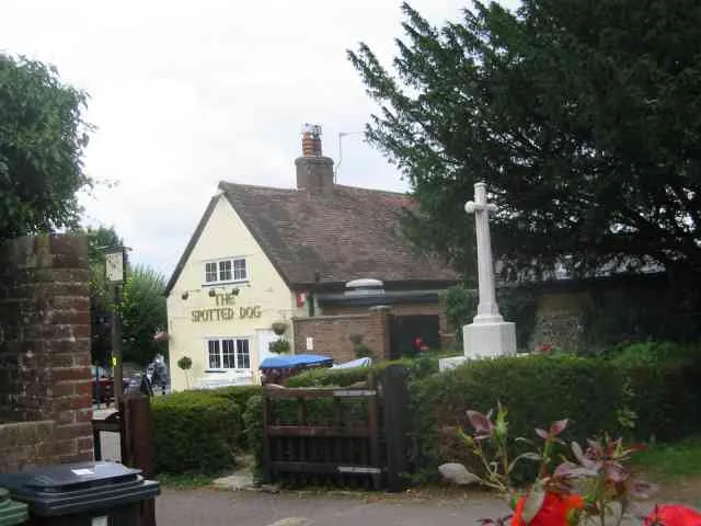 The Spotted Dog Pub and the War Memorial, Flamstead. Both looked well cared for. This is a photo of listed building number 1100382.