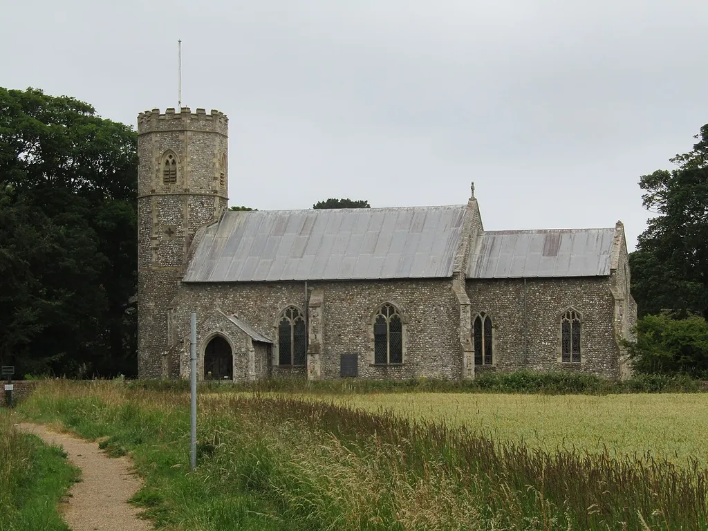 The south facing elevation of the parish church of Saint Michael and All Angels within the village of sidestrand, Norfolk, England.