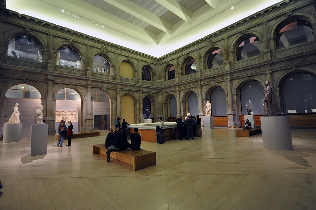 The Museo del Prado is a museum and art gallery located in Madrid. It features one of the world's finest collections of European art, from the 12th century to the early 19th century, based on the former Spanish Royal Collection. Founded as a museum of paintings and sculpture, it also contains important collections of more than 5,000 drawings, 2,000 prints, 1,000 coins and medals, and almost 2,000 decorative objects and works of art. Sculpture is represented by more than 700 works and by a smaller number of sculptural fragments. It is one of the most visited sites in Madrid [Wikipedia.org].