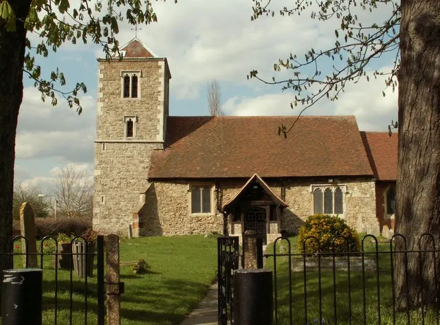 Nave and west tower of Holy Cross parish church, Basildon, Essex, seen from the south. This is the parish church of the original village of Basildon. The nave is 14th century, the tower was built about 1500 and the chancel (behind the tree on the right) was rebuilt in brick in 1597.
