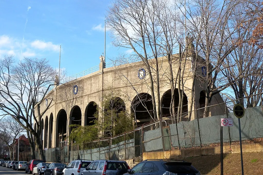 Looking west across Dartmouth Street at stand of FH Stadium on a sunny early afternoon.