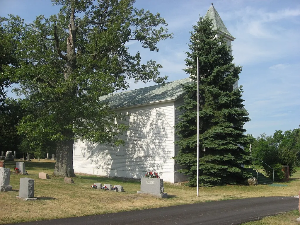 Front and eastern side of the former Independence Methodist Church, located at the junction of N500E and E375N southwest of Medaryville in Gillam Township, Jasper County, Indiana, United States. Built in 1872, it is listed on the National Register of Historic Places.