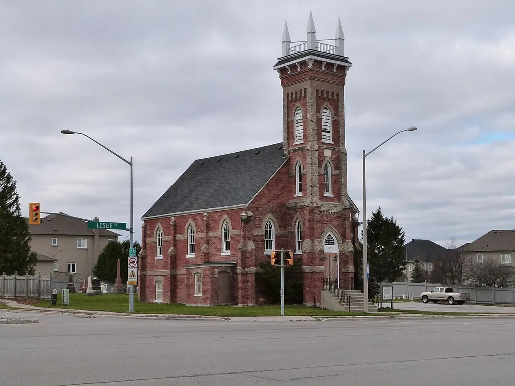 Headford United Church is located on the west side of Leslie Street just south of Major Mackenzie Drive East. The settlement of Headford, also known as Headford Mills was a distinct community in the 19th century, including a number of mills, shops and a general store. Today, the most recognizable vestige remaining is the Headford United Church with its adjoining cemetery. Originally a Methodist Episcopal Church, it was dedicated in 1850. Services were held in a small frame building known as Leek’s Chapel until the brick church was built in 1882.