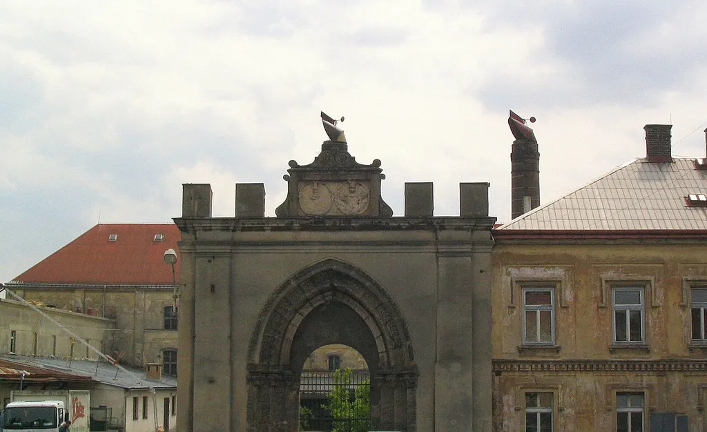 Klášter Hradiště nad Jizerou. Free standing original Gothic portal (c. 1260) wih fragment of northern wall of former monastery church destroyed by Hussites in 1420. Later a chateau was built on the site (converted to brewery since 19th century). Above the portal arms of Budovec family with year 1613.