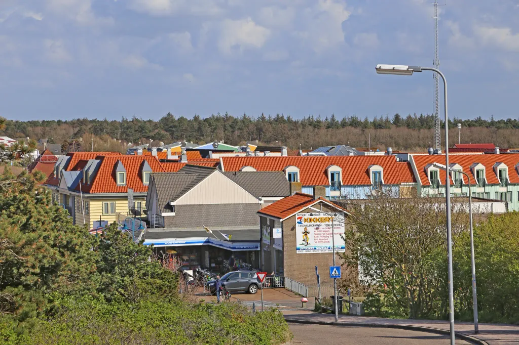 Village De Koog on the Dutch island of Texel (view from the dune). The suburb of De Koog with about 1,600 inhabitants is only separated from the North Sea by a chain of dunes and surrounded by a forest area.
