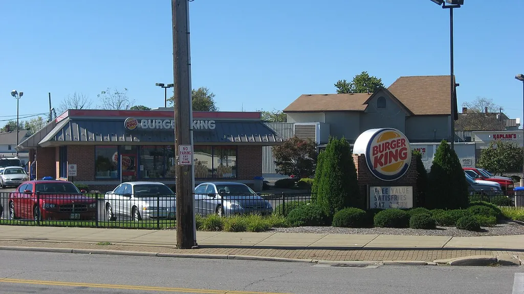 Front of a Burger King restaurant located at 600 W. Broad Street in Elyria, Ohio, United States. It occupies the site of Old St. John's Church, which was built in 1889; listed on the National Register of Historic Places in 1979, it did not lose this designation until 2016, years after its destruction.
