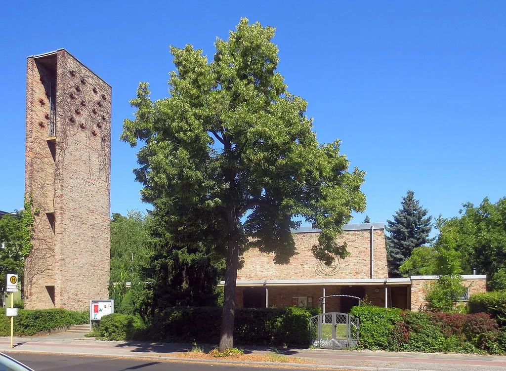 The protestant Saint Michael Church at Eythstraße No. 8-10 in Berlin-Schöneberg. The building was constructed in 1955 to designs by F. O. Seeger &amp; Günther Kohlhaus. A neighboring paris hall was added in 1964 at Bessemerstraße No. 97-101, built to a design by Kohlhaus. The complex has been designated as a cultural heritage monument.