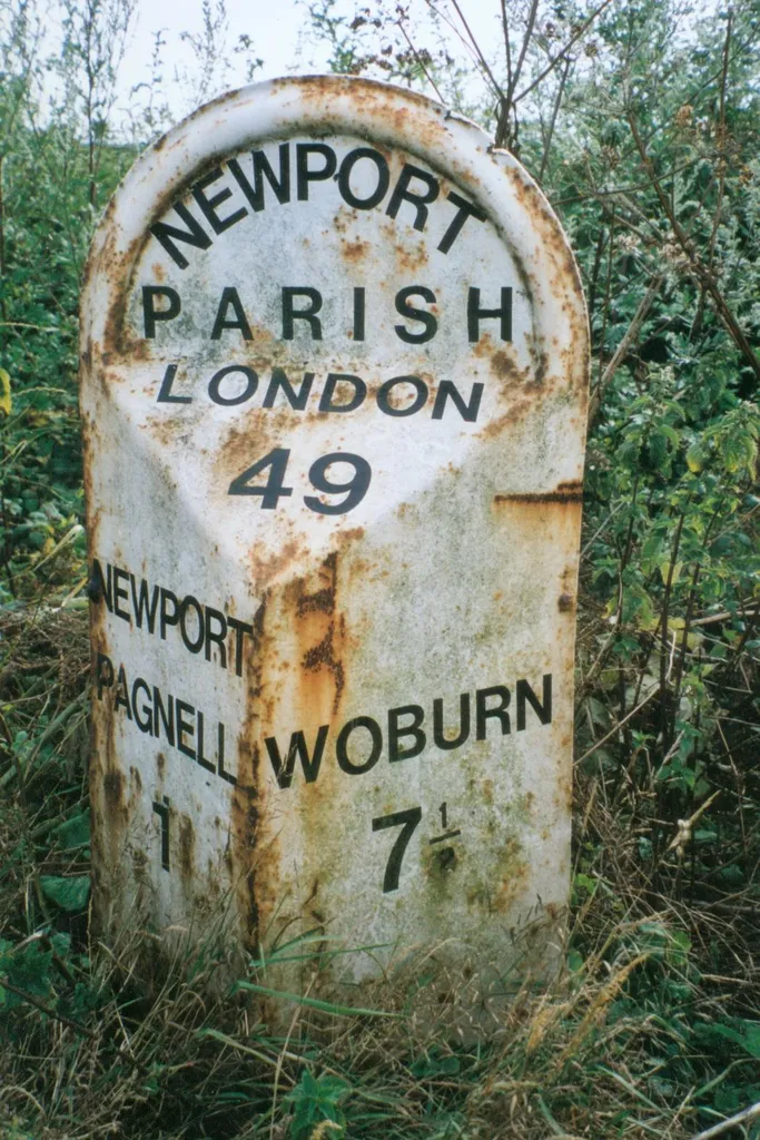 Milepost, London Road; S of Newport Stables, and 300m S of Tickford island (jct with A422)