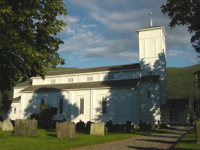 Nesset and the Nesset kirke This is a photo of a monument in Norway, number: 85125 in the Norwegian Directorate for Cultural Heritage database.