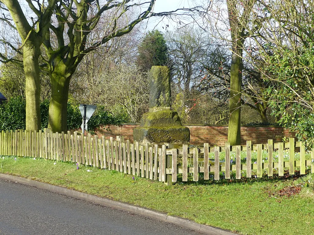 Standing cross base near the junction of Church Lane and Woodhouse Lane, 600m NNW of New Hall Farm: scheduled monument in Gawsworth, Cheshire. .mw-parser-output .messagebox{margin:4px 0;width:auto;border-collapse:collapse;border:2px solid var(--border-color-progressive,#6485d1);background-color:var(--background-color-neutral-subtle,#fbfcff);color:var(--color-base,#202122);box-sizing:border-box;border-inline-start-width:8px}.mw-parser-output .messagebox.mbox-small{font-size:88%;line-height:1.25em}.mw-parser-output .mbox-warning,.mw-parser-output .mbox-speedy{border:2px solid var(--border-color-error,#b22222);background:var(--background-color-error-subtle,#ffdbdb);border-inline-start-width:8px}.mw-parser-output .mbox-serious,.mw-parser-output .mbox-delete,.mw-parser-output .mbox-stop{border:2px solid var(--border-color-error,#b22222);border-inline-start-width:8px}.mw-parser-output .mbox-issue,.mw-parser-output .mbox-content{border:2px solid #f28500;background:var(--background-color-warning-subtle,#ffe);border-inline-start-width:8px}.mw-parser-output .mbox-query,.mw-parser-output .mbox-style{border:2px solid #f4c430;background:var(--background-color-warning-subtle,#ffe);border-inline-start-width:8px}.mw-parser-output .mbox-shit{border:2px solid #960;border-inline-start-width:8px}.mw-parser-output .mbox-license{border:2px solid #88a;border-inline-start-width:initial}.mw-parser-output .mbox-legal{border:2px solid var(--border-color-notice,#666);background:var(--background-color-base,#fff);border-inline-start-width:8px}.mw-parser-output .mbox-honor{border:2px solid #ca3;background:var(--background-color-warning-subtle,#fcf4db);border-inline-start-width:8px}.mw-parser-output .mbox-growth{border:2px solid #8d4;background:var(--background-color-success-subtle,#d5fdf4);border-inline-start-width:8px}.mw-parser-output .mbox-move{border:2px solid #93c;border-inline-start-width:8px}.mw-parser-output .mbox-protection,.mw-parser-output .mbox-message{border:2px solid var(--border-co