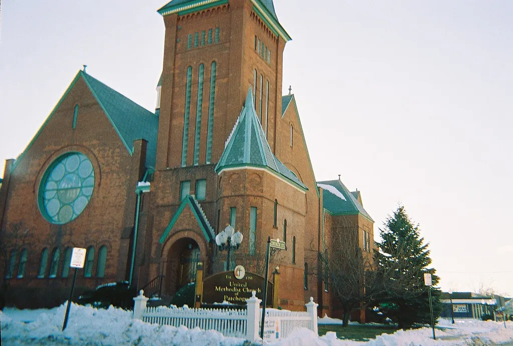 View of the historic United Methodist Church on the corner of South Ocean Avenue and Church Street in Patchogue, New York. This is an image of a place or building that is listed on the National Register of Historic Places in the United States of America. Its reference number is 84003006 (Wikidata).
