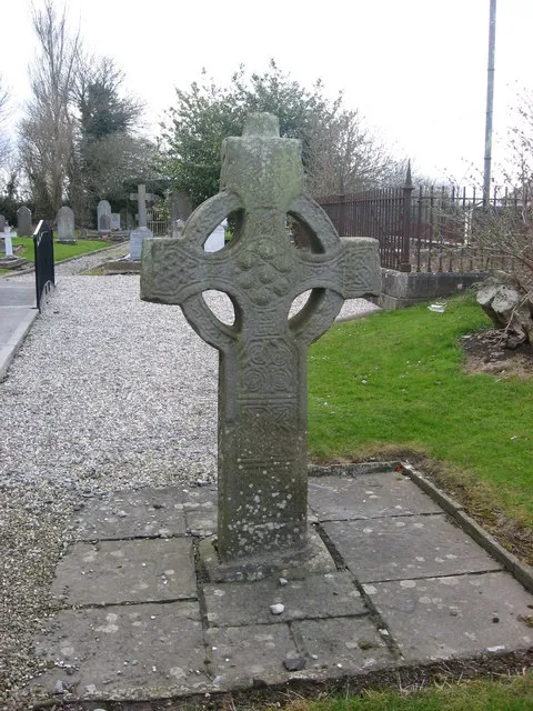 High Cross at Duleek The 9th-century 'high cross' in the graveyard of the decommissioned St. Cianan's Church of Ireland. The east face bears panels of geometrical interlace. The tenon would have held the house-shaped cap-stone.
