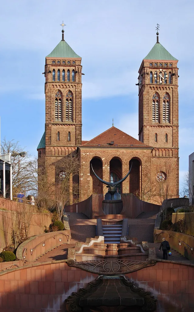 The Catholic parish church St. Pirmin and the Schloßbrunnen in the city of Pirmasens, Rhineland-Palatinate.