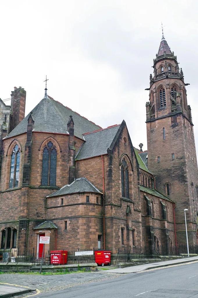By the highly regarded Edinburgh practice Sydney Mitchell and Wilson, 1888. Basilica plan, late Gothic former church set on prominent corner site with large vaulted basements. Dominated by an impressive 4-stage tower with octagonal belfry and flying buttresses. Squared and snecked red sandstone with some ashlar quoins. This is a well detailed late Gothic composition on a prominent corner site by the influential practice of Sydney Mitchell and Wilson, originally known as the Dean Free Church. The design makes clever use of the falling ground, with the former church hall located in the deep basements to Belford Road. The whole building articulates an important corner, lining a major route into the city from the N. The tower is particularly impressive, and is an important landmark for the Dean Village over which it dominates the skyline. Original architects' drawings and secondary sources suggest a fine interior with alternating round and octagonal piers to the nave with moulded capitals. Corbelled clusters of attached columns support the hammerbeam roof above. The use of 17th century sources is characteristic of Sydney Mitchell at this time, he worked in the Scots Renaissance style throughout the 1880's and 1890's. The interior is known to contain stained glass by the Bromsgrove Guild in the apse and N transept. An 1883 Gothic marble relief tablet of Sir Henry Wellwood Moncrieff by Hippolyte J Blanc also featured in the original interior scheme.
