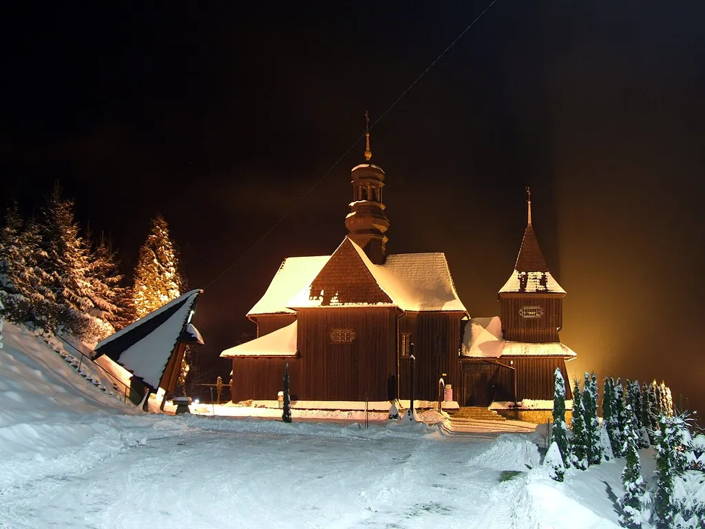 Skawinki, Poland - St. Joachim wooden church by night