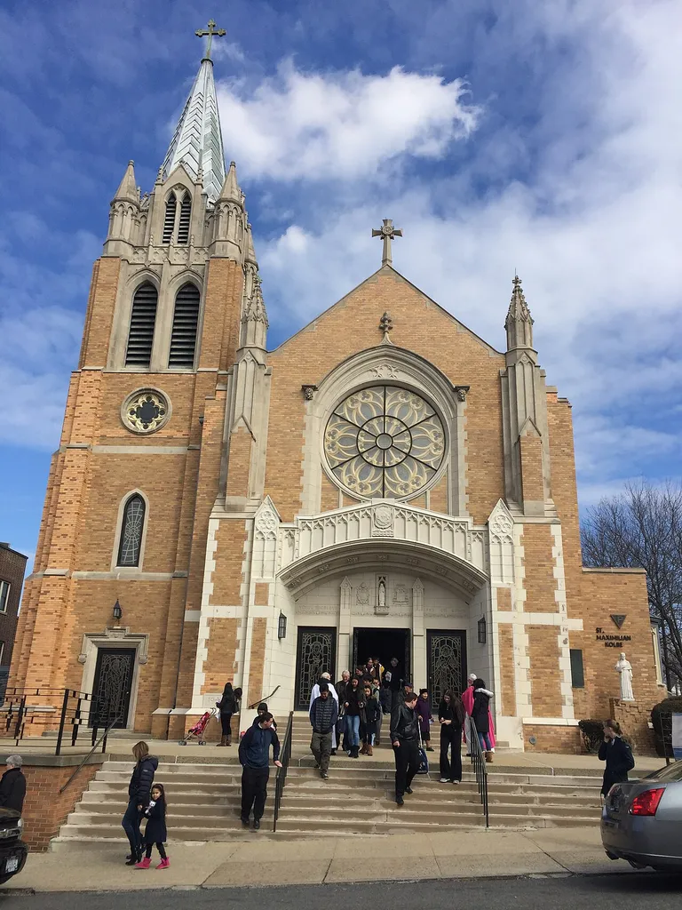 Parishioners exiting after mass from the Saint Adalbert Roman Catholic Church at Elmhurst, Queens, New York. Parishioners are being greeted by priests.