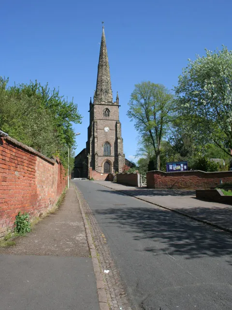 Church Lane, Whetstone, Leicestershire, with the west tower and spire of St Peter's parish church in the distance