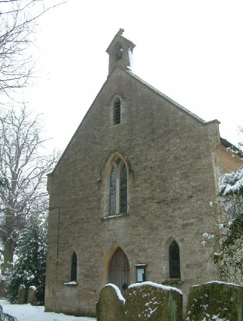 West front of Holy Trinity parish church, Finstock, Oxfordshire, seen from the southwest in snow
