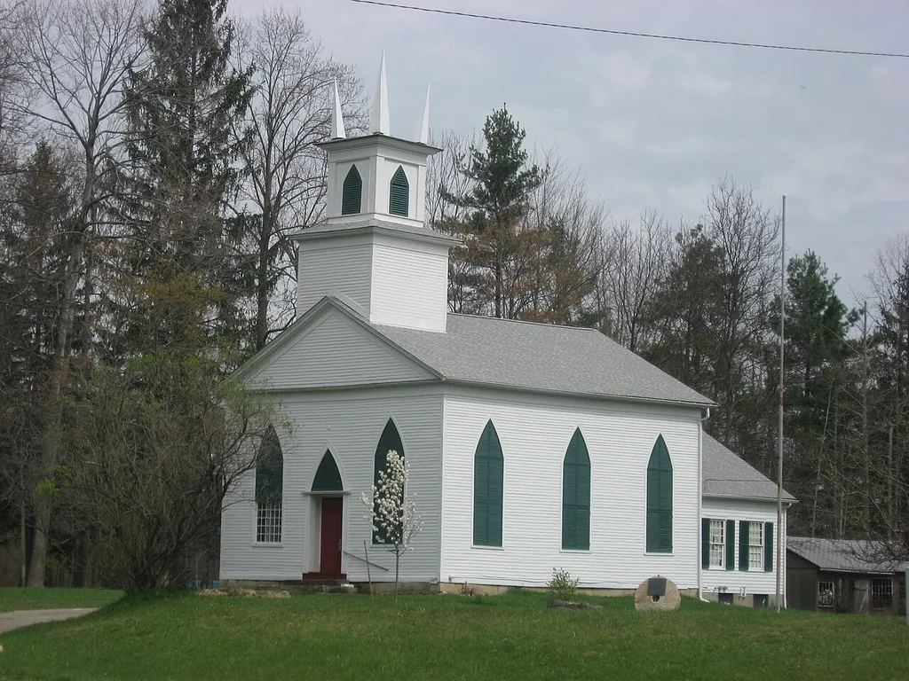 Front and southern side of the former Windsor Mills Christ Church Episcopal, located on the northeastern corner of the junction of U.S. Route 322 and Wiswell Road at Windsor Mills in Windsor Township, Ashtabula County, Ohio, United States. Built in 1832 and since converted into a museum, it is listed on the National Register of Historic Places.