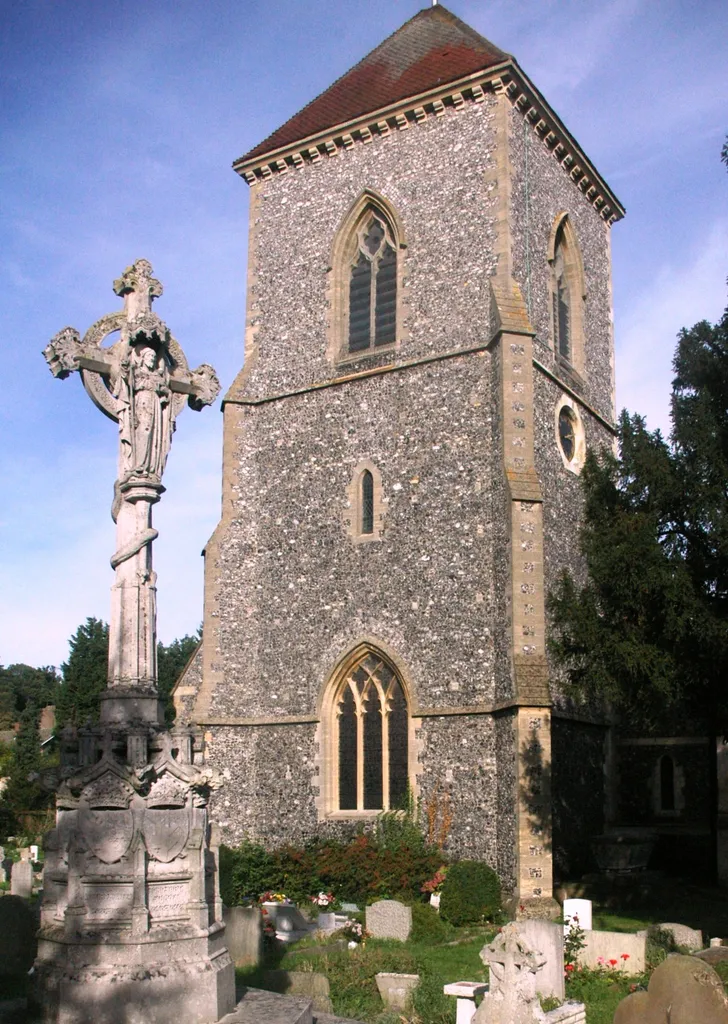 West tower of St Mary's parish church, Addington, London Borough of Croydon, with the memorial to five Archbishops in the left foreground