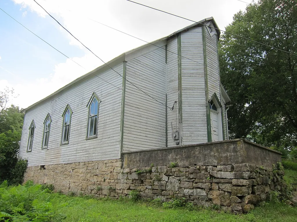 The Old Capon Bridge Christian Church is a former Christian (Disciples of Christ) church in Capon Bridge in the U.S. state of West Virginia. The Old Capon Bridge Christian Church is located along Cacapon River Road (West Virginia Secondary Route 14) and overlooks the Cacapon River. Photographed by Justin A. Wilcox of Washington, D.C. on July 14, 2013.
