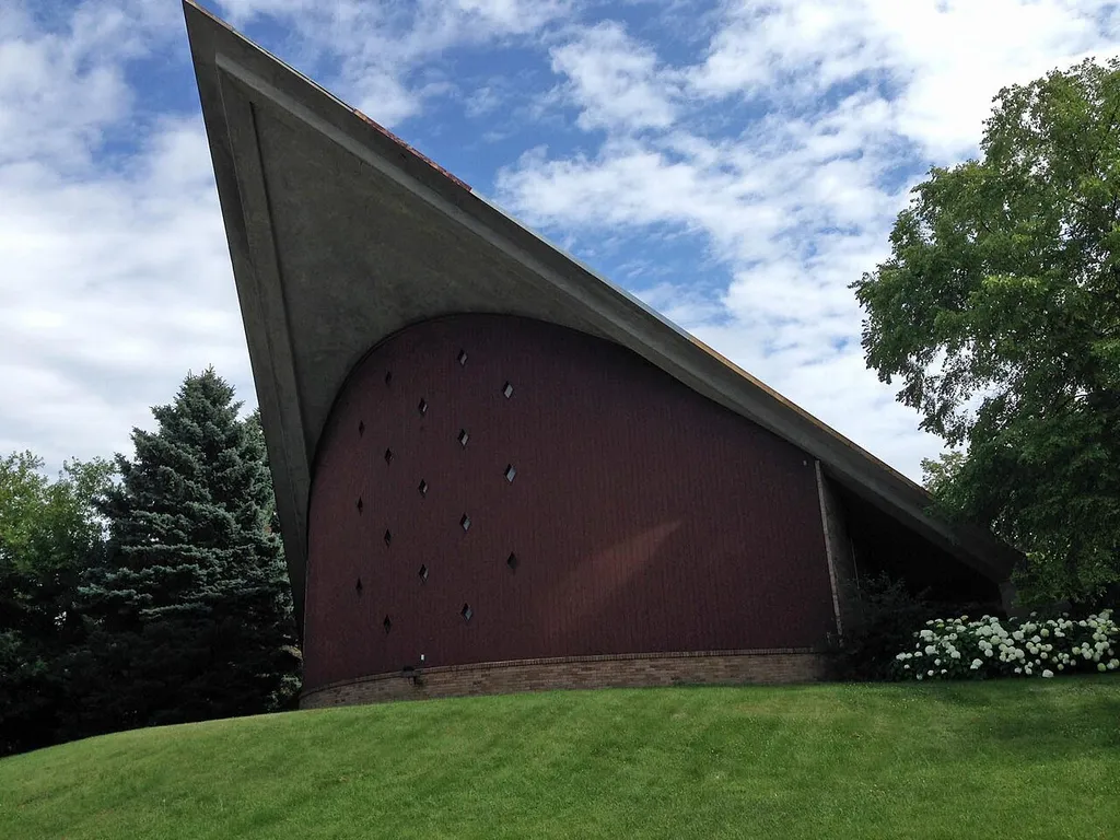 St. Edmunds Church — on Watertown Plank Road in Elm Grove, Waukesha County, Wisconsin. It was designed by the renowned Milwaukee architect William Wenzler, and was completed in 1957. It is one of the best local examples of Mid-Century Modern Architecture, and its poured concrete roof, which extends 45 beyond the altar, is one of the first local examples of a 'hyperbolic paraboloid.'