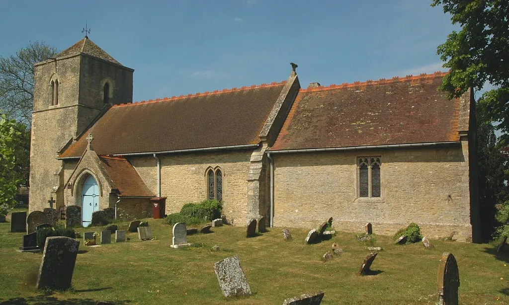 Church of England parish church of Saint Andrew, Oddington, Oxfordshire. North elevation showing Early English Gothic tower and 1886 rebuilding of nave and chancel.