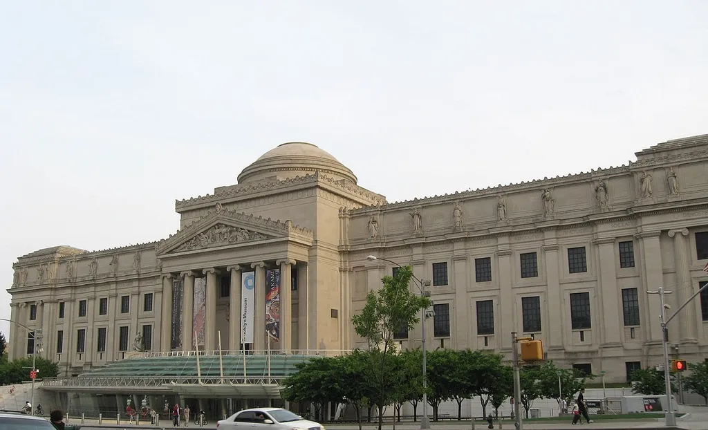 Brooklyn Museum shortly before sunset on a partly cloudy day.