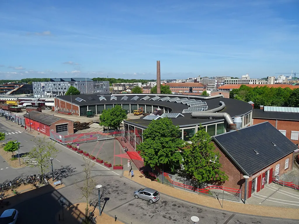 Danmarks Jernbanemuseum seen from the parking lot above Odense Station in Denmark. The museum building is a former roundhouse.