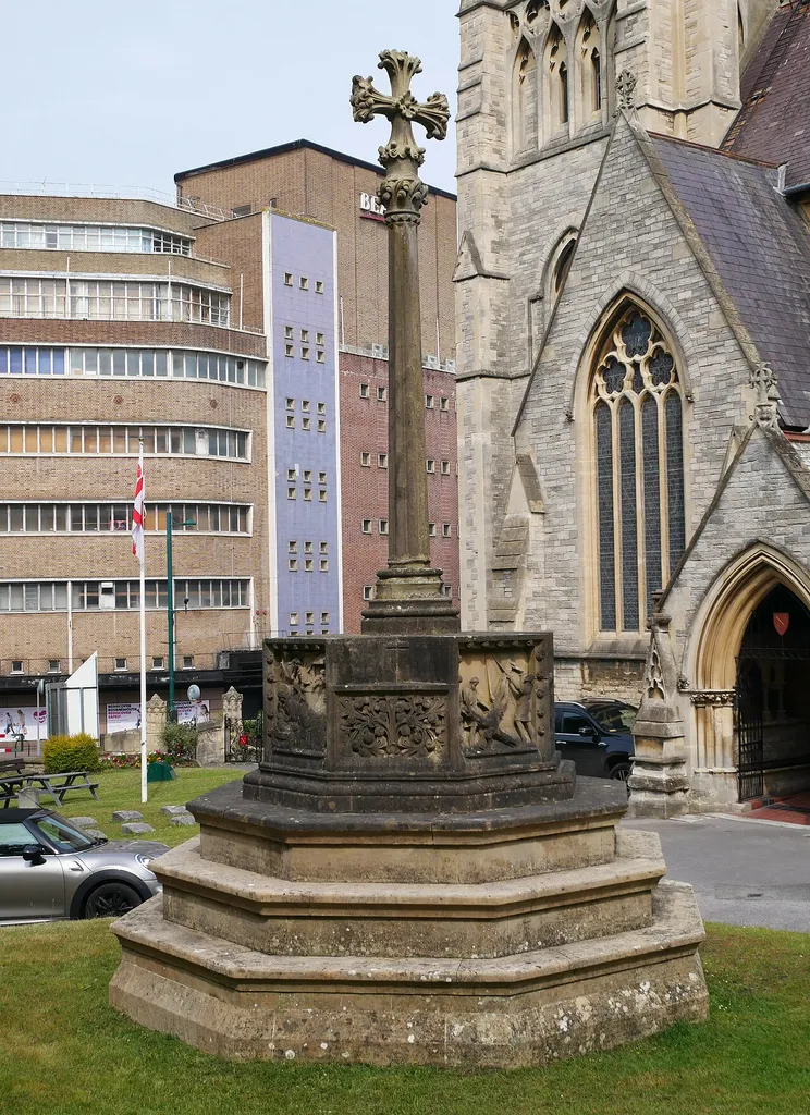 A southeast view of the churchyard cross to the south of the Church of St Peter in Bournemouth, Dorset.