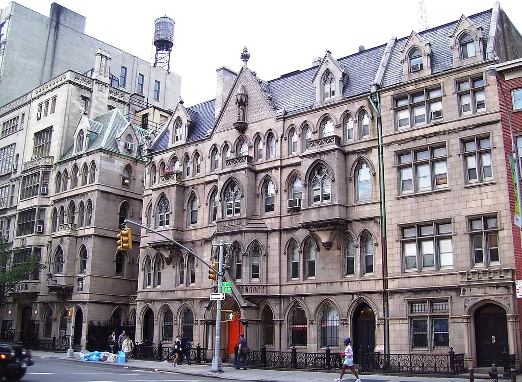 The church houses of Grace Church on Fourth Avenue at 11th Street in Greenwich Village near Astor Place, Manhattan, New York City. The center three bays are Grace Memorial House/Huntington House (1881-1882, James Renwick Jr.), on the left is Clergy House (1902-1903, Heins &amp; La Farge), and on the right Neighborhood House (1906-1907, Renwich, Aspinwall &amp; Tucker). To the far left can be seen a bit of the main buildings of Grace Church School, which also utilizes the church houses. (Source: Guide to NYC Landmarks (4th ed.) and AIA Guide to NYC (4th ed.))