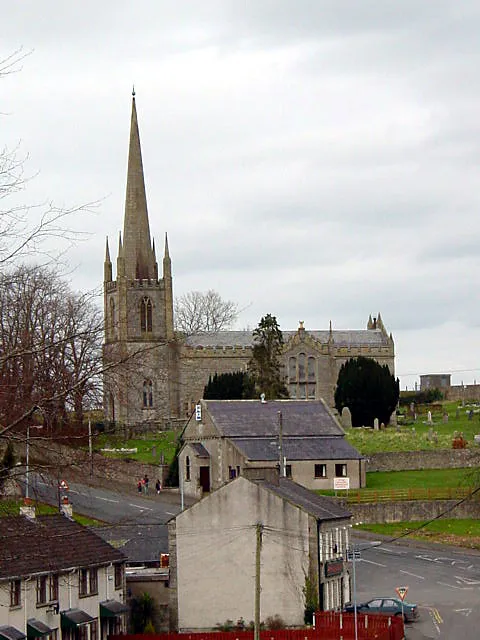 St John's Parish Church, Caledon. Taken from near the Presbyterian Church on the other side of the valley, with the B45 running though the valley bottom. The building immediately below St John's Church is Caledon Elim Church, formerly the Wesleyan Methodist Chapel.