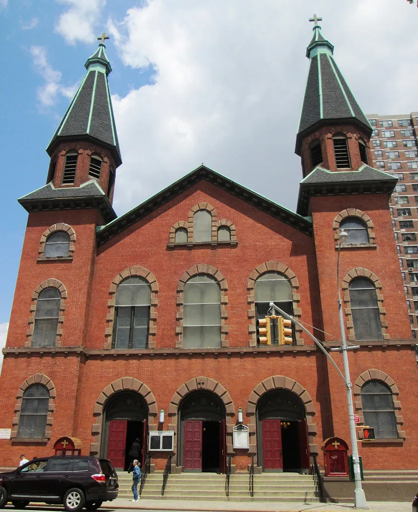 St. Mary's Roman Catholic Church at 438 Grand Street between Pitt and Attorney Streets in the Lower East Side neighborhood of Manhattan, New York City was built in 1832-33, and was enlarged and had its current facade added in 1864 by Patrick Charles Keely. Additional changes were made by Lawrence O'Connor in 1871. It is the second oldest Roman Catholic structure in the city, after St. Patrick's Old Cathedral, which was built in 1815. The original facade was in the Greek Revival style, but Keely's new red-brick facade with twin spires is in the Romanesque Revival style. (Sources: AIA Guide to NYC (5th ed.) and NYCAGO)