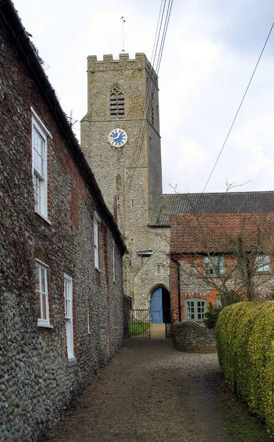 Hindringham, Norfolk: view north past St Martin's House (right) and the 17th-century Church Farmhouse (left) to the south porch and west tower of St Martin's parish church