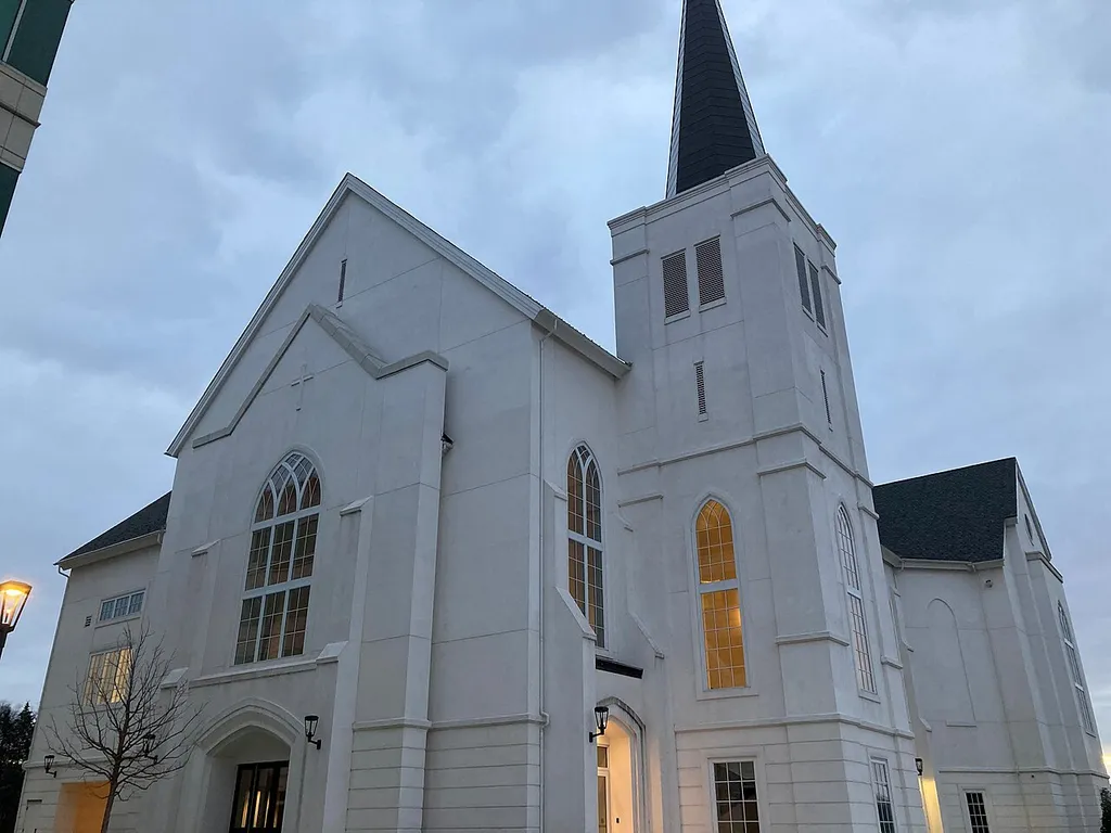 The steeple and main entrance of The Falls Church Anglican in West Falls Church, Virginia. Photo taken at sunset looking southwest.