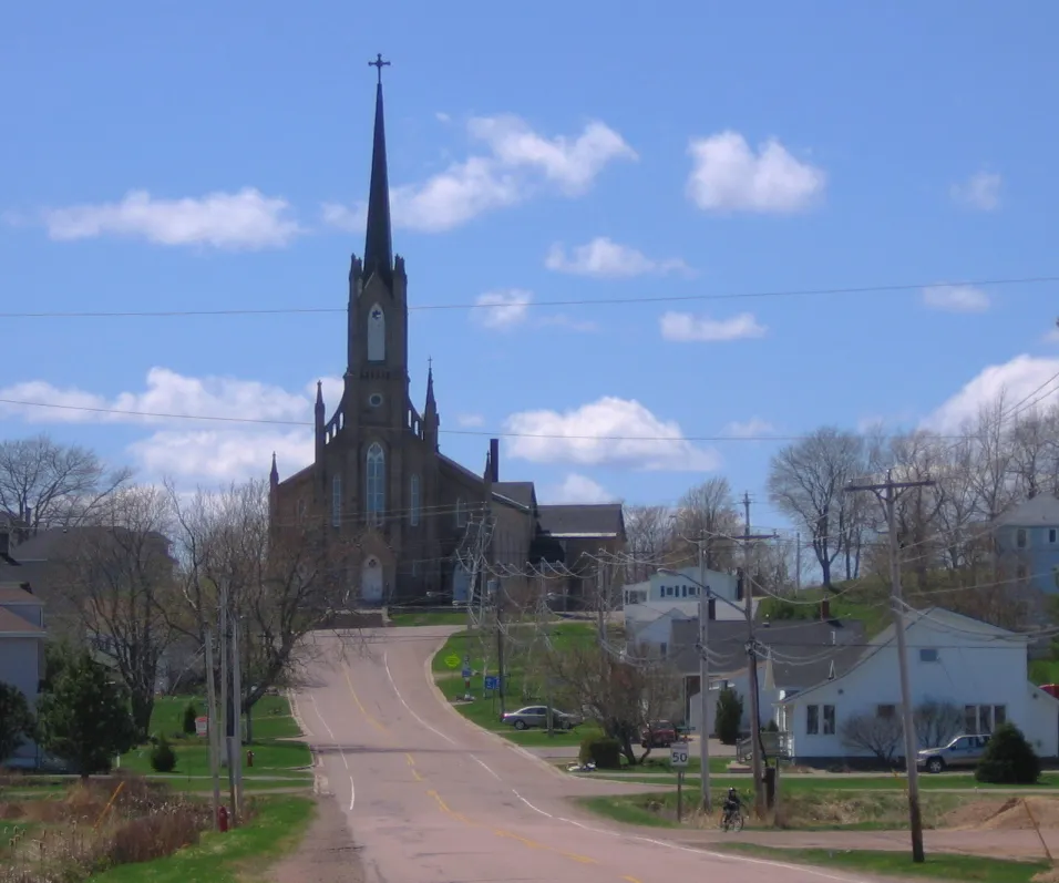 View of the community of St. Joseph in Memramcook, New Brunswick. The view is from from the Memramcook marsh and shows Saint-Thomas de Memramcook Church.