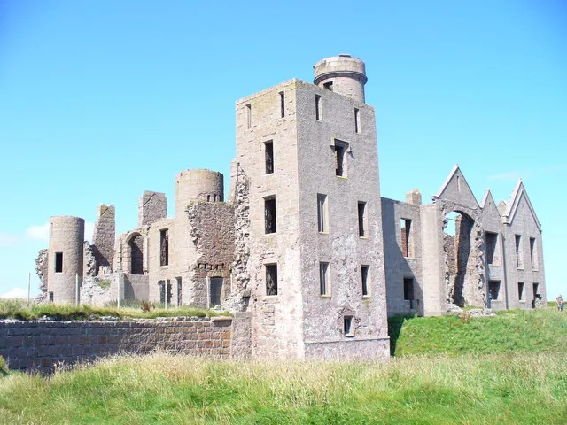 Ruined Slains Castle Huge clifftop pile built of local pink granite. This corner is the oldest part of the castle. http://www.aboutaberdeen.com/slainscastle.php