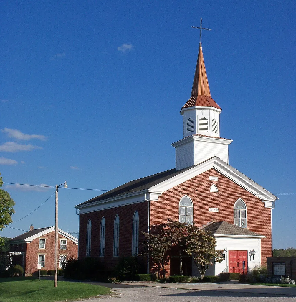 St. Mary's Catholic Church of Morges, Ohio is listed on the NRHP. In September, 2012 a new bell (used, but functional), was hung in the bell tower, and old, cracked bells were removed. A new roof and shutters, along with structural work were installed on tower. 1851 church is viewed from northwest, with 1853 parish residence seen in left rear.