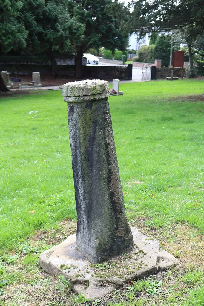 Grade II listed sundial dating to ?1764 in the churchyard of St Andrew's Church, Bebington, Wirral. VIew from the north
