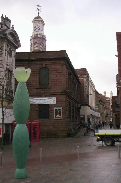 Holy Trinity Church, Warrington. 1760. Architect: J. Meredith OR J. Gibbs. The green column is one of the "guardians" (locally known as the skittles) designed by American sculptor Howard Ben Tré as part of the town centre's public art.