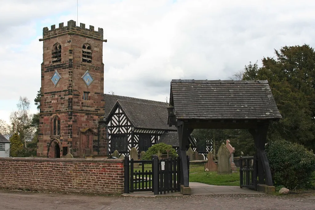 Lychgate, St Oswald's Churchyard: Grade II listed lych-gate in Lower Peover, Cheshire. .mw-parser-output .messagebox{margin:4px 0;width:auto;border-collapse:collapse;border:2px solid var(--border-color-progressive,#6485d1);background-color:var(--background-color-neutral-subtle,#fbfcff);color:var(--color-base,#202122);box-sizing:border-box;border-inline-start-width:8px}.mw-parser-output .messagebox.mbox-small{font-size:88%;line-height:1.25em}.mw-parser-output .mbox-warning,.mw-parser-output .mbox-speedy{border:2px solid var(--border-color-error,#b22222);background:var(--background-color-error-subtle,#ffdbdb);border-inline-start-width:8px}.mw-parser-output .mbox-serious,.mw-parser-output .mbox-delete,.mw-parser-output .mbox-stop{border:2px solid var(--border-color-error,#b22222);border-inline-start-width:8px}.mw-parser-output .mbox-issue,.mw-parser-output .mbox-content{border:2px solid #f28500;background:var(--background-color-warning-subtle,#ffe);border-inline-start-width:8px}.mw-parser-output .mbox-query,.mw-parser-output .mbox-style{border:2px solid #f4c430;background:var(--background-color-warning-subtle,#ffe);border-inline-start-width:8px}.mw-parser-output .mbox-shit{border:2px solid #960;border-inline-start-width:8px}.mw-parser-output .mbox-license{border:2px solid #88a;border-inline-start-width:initial}.mw-parser-output .mbox-legal{border:2px solid var(--border-color-notice,#666);background:var(--background-color-base,#fff);border-inline-start-width:8px}.mw-parser-output .mbox-honor{border:2px solid #ca3;background:var(--background-color-warning-subtle,#fcf4db);border-inline-start-width:8px}.mw-parser-output .mbox-growth{border:2px solid #8d4;background:var(--background-color-success-subtle,#d5fdf4);border-inline-start-width:8px}.mw-parser-output .mbox-move{border:2px solid #93c;border-inline-start-width:8px}.mw-parser-output .mbox-protection,.mw-parser-output .mbox-message{border:2px solid var(--border-color-base,#aaa);border-inline-start-width:8px}.mw-parser-