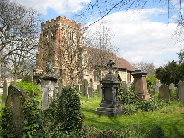 East Ham: Church of St Mary Magdalene, near to Beckton, Newham, Great Britain. There has reputedly been a church on this site since before the Norman Conquest of 1066 although the present church is thought to date from no earlier than the first half of the 12th century. The tower probably dates from the early 13th century, but has been much restored. The church suffered from bomb damage in 1941, including the loss of all of its stained glass windows. The churchyard covers an area of about 9.5 acres but has recently been closed for burials. Since 1977 most of the churchyard has been left as a nature reserve, managed by the London Borough of Newham as East Ham Nature Reserve, although this area around the church is maintained for worshippers and weddings. The flag of St George is fluttering from the flagstaff on the tower.