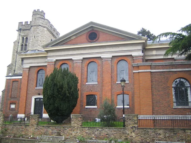 Twickenham: St Mary's Church. The odd mixture of building styles of the ragstone tower and red brick nave and chancel in this church is due to the fact that the original church collapsed in 1713, leaving just the tower. The church was quickly rebuilt and completed in 1714. The Twickenham Museum web page for the church is here http://www.twickenham-museum.org.uk/detail.asp?ContentID=177