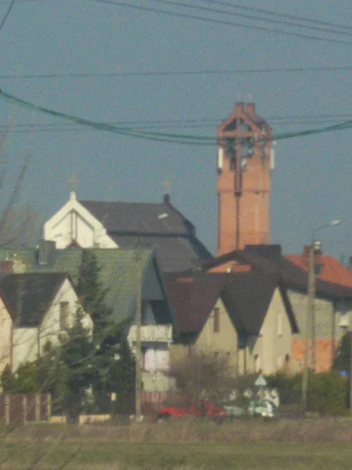 Mary Help of Christians church in Kutno, view from Hutnik train