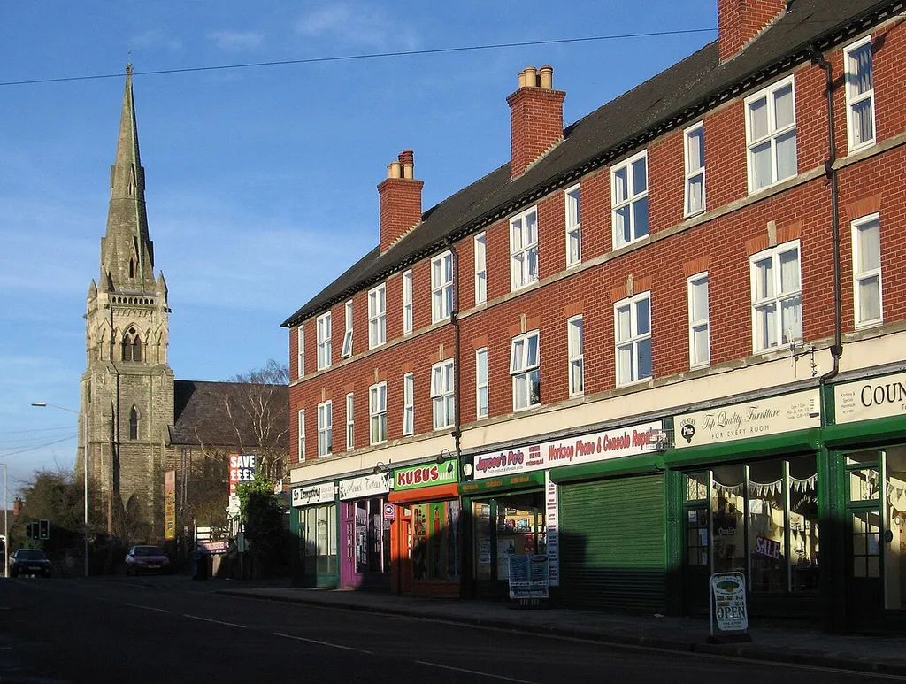 Gateford Road, Worksop, Nottinghamshire, England, showing the tower and spire of St John the Evangelist parish church